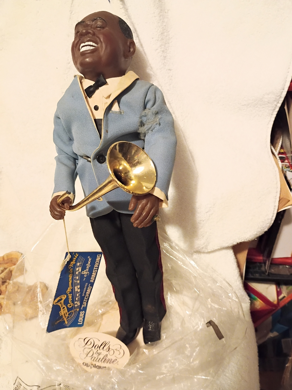 Smiling Musician Louis Satchmo Armstrong.Sculpture in Blue Jacket with Gold Horn